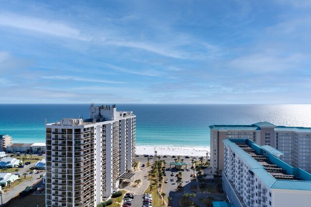 drone / aerial view with a water view and a beach view