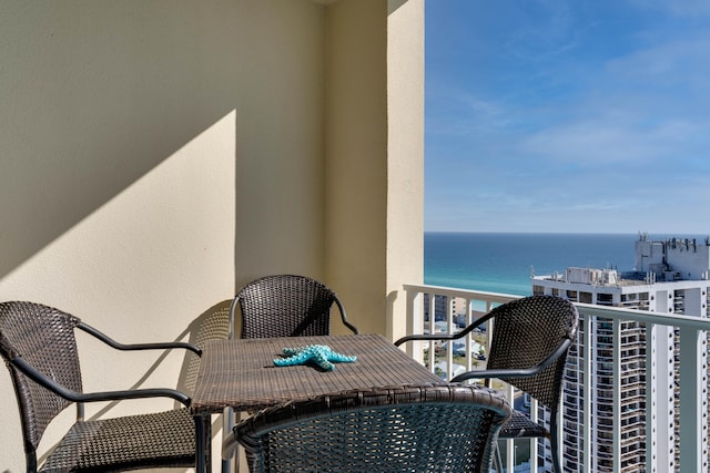 balcony featuring a water view