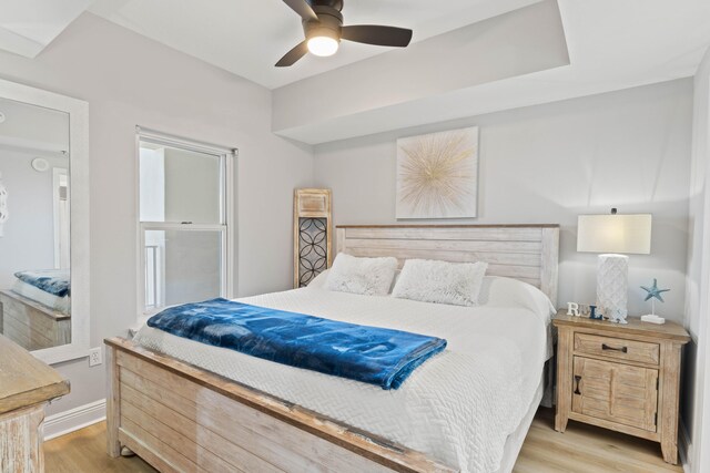 bedroom featuring ceiling fan and light hardwood / wood-style flooring