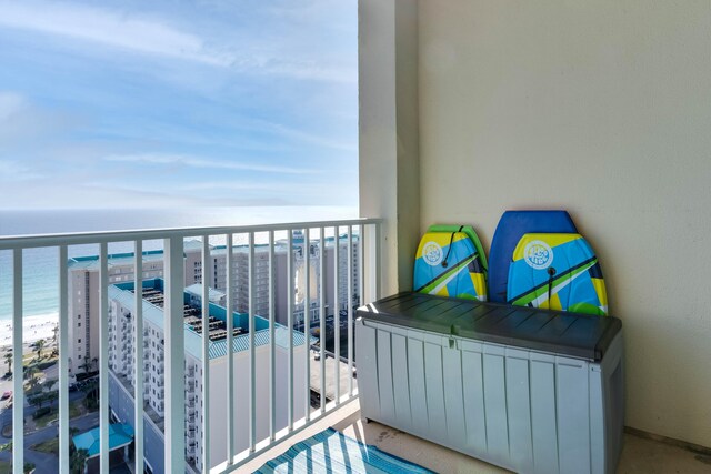 balcony with a view of the beach and a water view