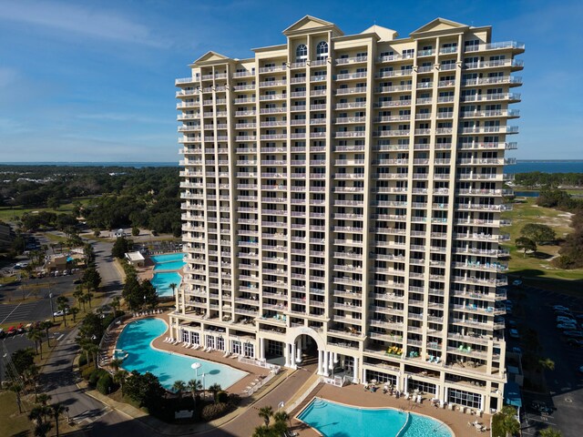 view of property featuring a community pool