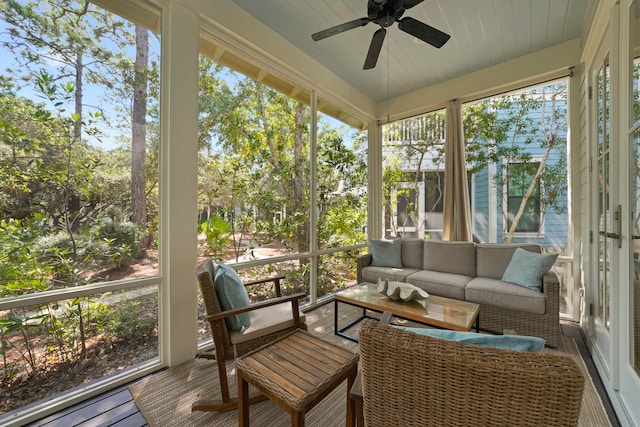 sunroom featuring ceiling fan