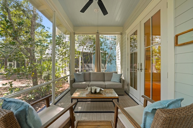 sunroom / solarium featuring french doors and ceiling fan