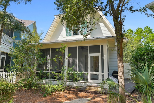 view of property exterior featuring a sunroom