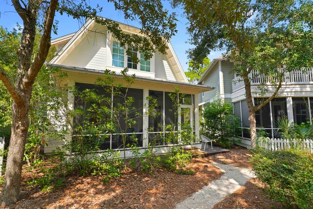 exterior space featuring a sunroom