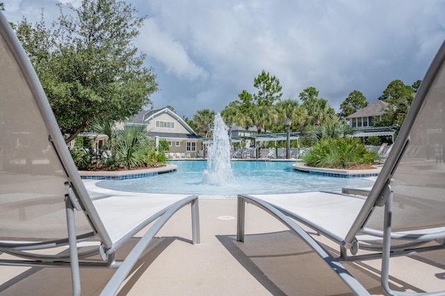 view of pool featuring pool water feature