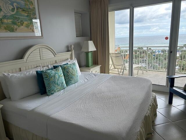 1751 Scenic Highway 98 Unit 614, Destin, FL 32541 - bedroom with a water view, access to exterior, and tile patterned floors
