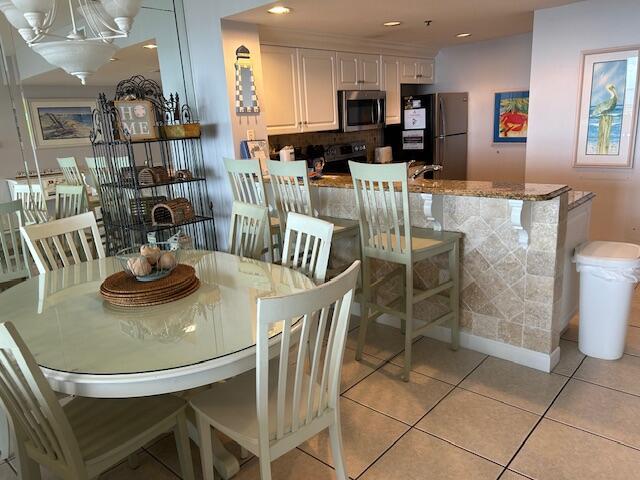 1751 Scenic Highway 98 Unit 614, Destin, FL 32541 - dining space featuring light tile patterned floors, recessed lighting, and a chandelier