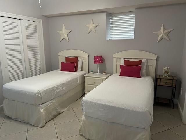 1751 Scenic Highway 98 Unit 614, Destin, FL 32541 - bedroom with light tile patterned floors and a closet