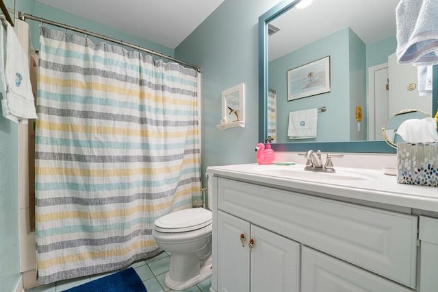 bathroom featuring tile patterned floors, a shower with curtain, vanity, and toilet