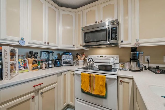 kitchen featuring white electric stove