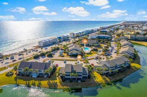 bird's eye view featuring a beach view and a water view