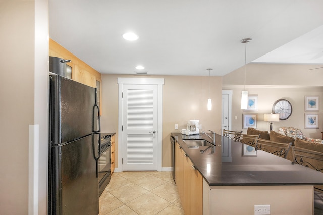 kitchen featuring black appliances, light brown cabinets, sink, hanging light fixtures, and light tile patterned floors