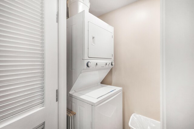 laundry area with stacked washer / dryer