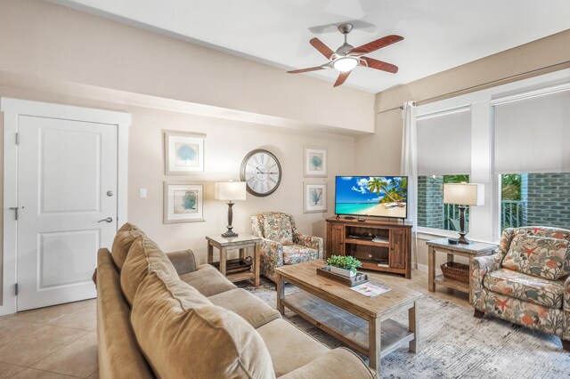 living room with light tile patterned floors and ceiling fan