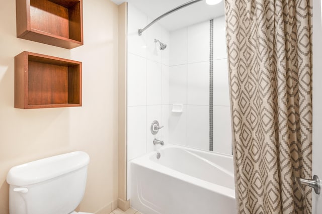 bathroom featuring shower / bath combo and toilet