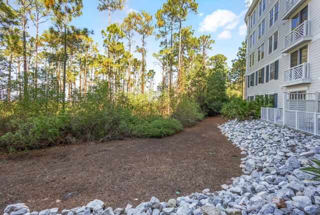 view of yard featuring a balcony