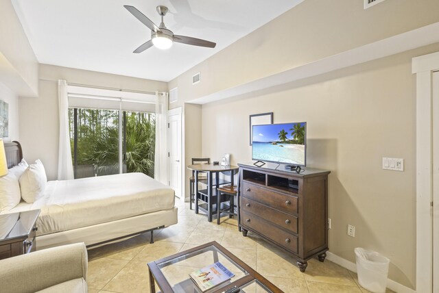 tiled bedroom with access to exterior and ceiling fan