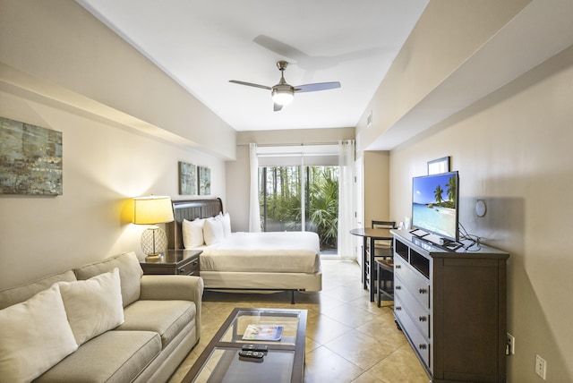 tiled bedroom featuring access to outside and ceiling fan