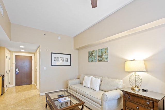 living room with ceiling fan and light tile patterned flooring