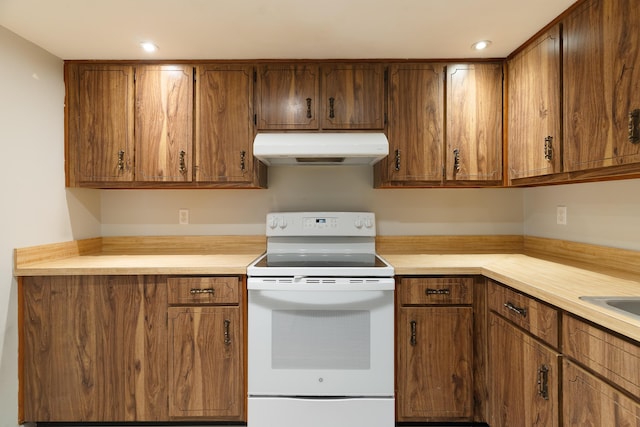 kitchen with white range with electric stovetop