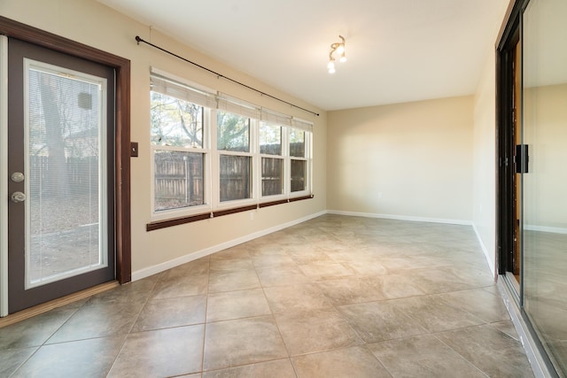 unfurnished room featuring light tile patterned flooring