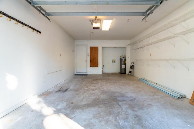 garage featuring electric water heater and a garage door opener