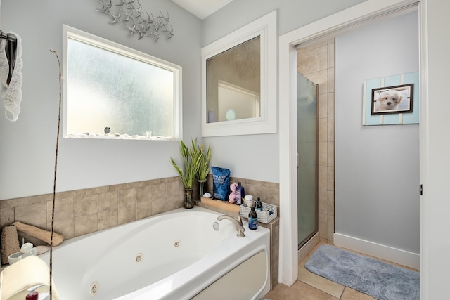 bathroom with tile patterned flooring and independent shower and bath