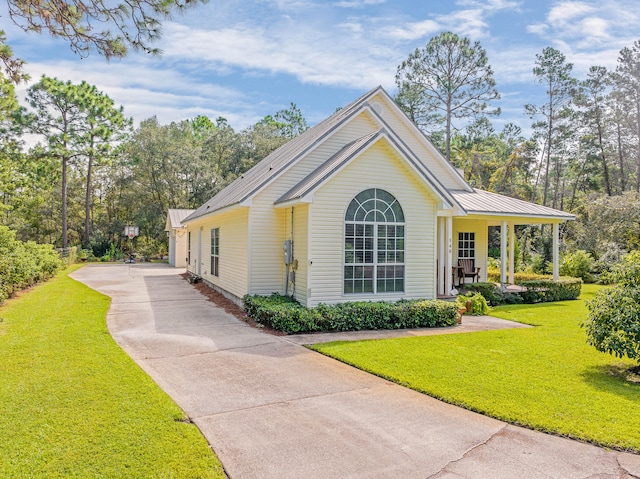 view of side of home featuring a lawn