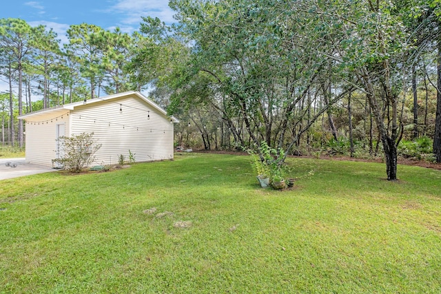 view of yard featuring a garage