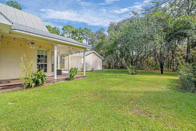 view of yard featuring a patio and ceiling fan