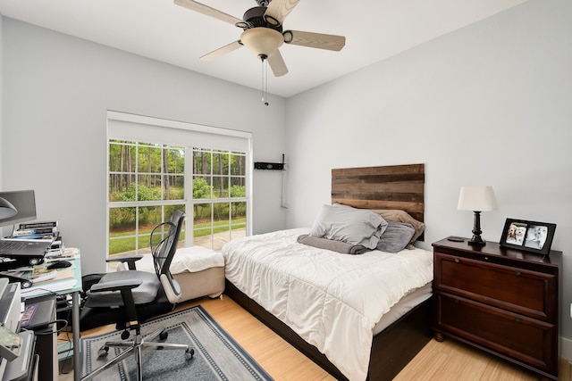 bedroom with light wood-type flooring and ceiling fan