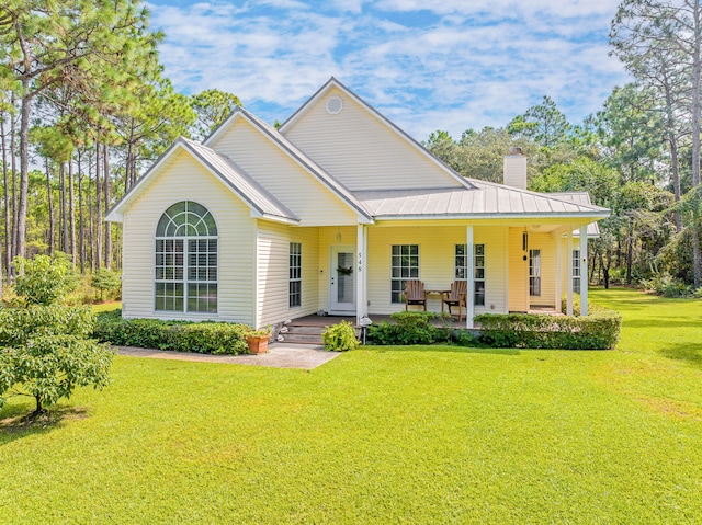 view of front of house with a porch and a front lawn