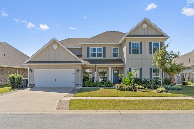 view of front facade featuring a front yard and a garage