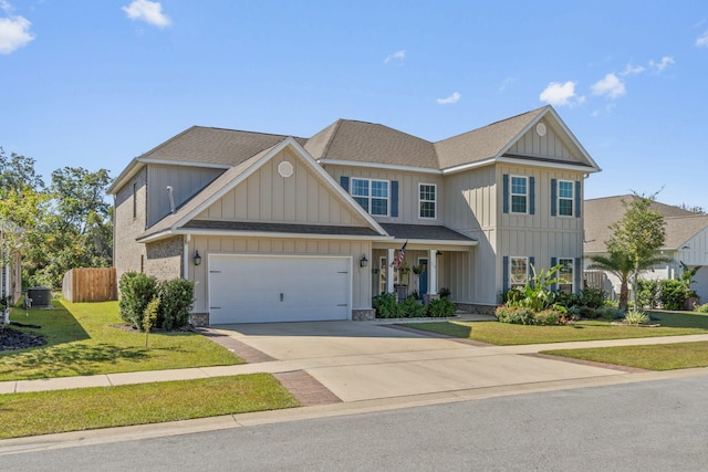 view of front facade featuring a front yard and a garage