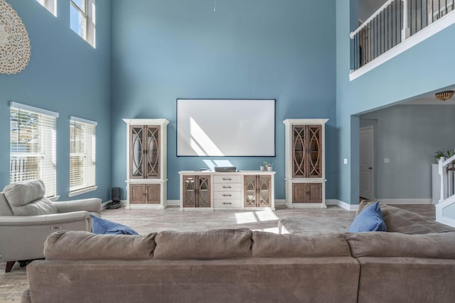 living room featuring a high ceiling