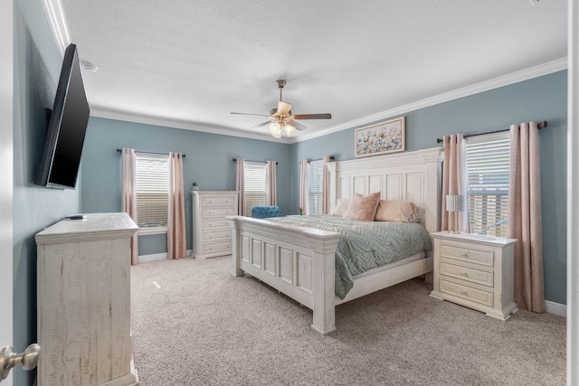 bedroom featuring ceiling fan, light carpet, a textured ceiling, and crown molding