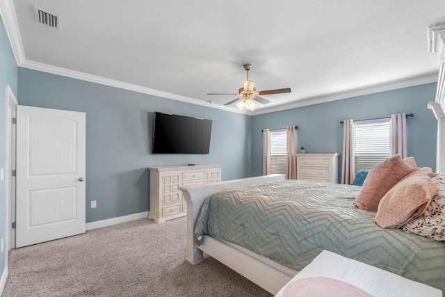 carpeted bedroom featuring crown molding and ceiling fan