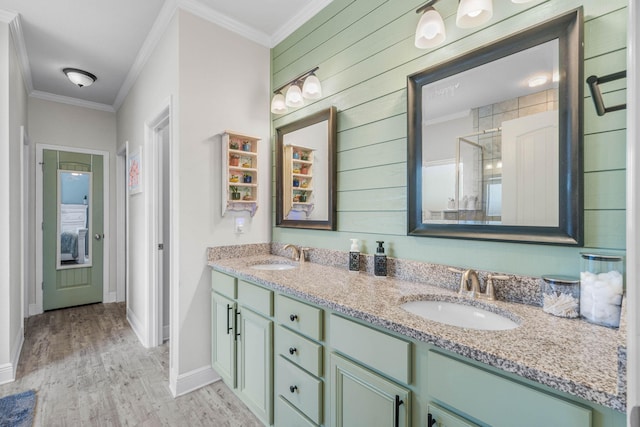 bathroom featuring hardwood / wood-style floors, an enclosed shower, vanity, crown molding, and wooden walls