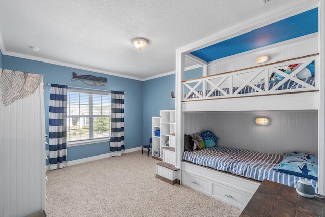 carpeted bedroom with crown molding, wood walls, and a textured ceiling