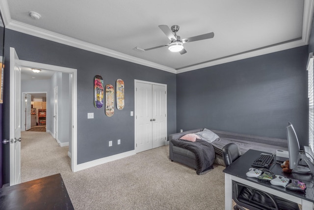 bedroom featuring a closet, ceiling fan, ornamental molding, and light colored carpet