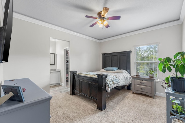 carpeted bedroom with ornamental molding, a textured ceiling, connected bathroom, and ceiling fan