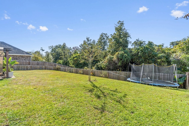 view of yard featuring a trampoline