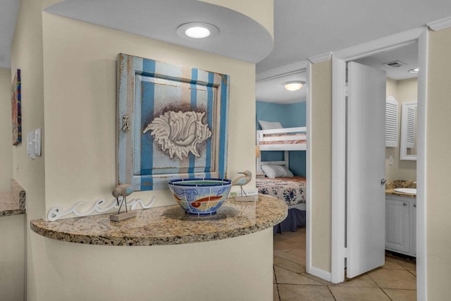 bathroom featuring tile patterned floors and vanity