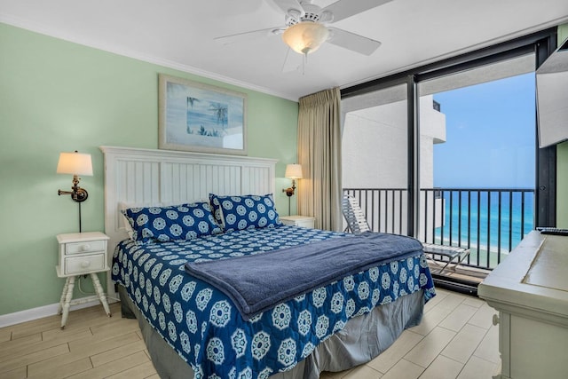 bedroom with ceiling fan and ornamental molding