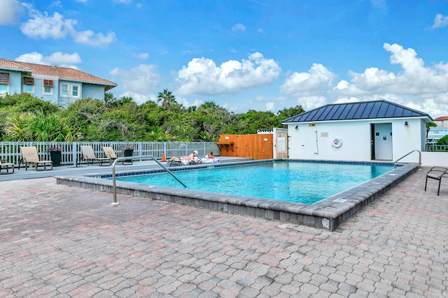 view of pool featuring a patio area