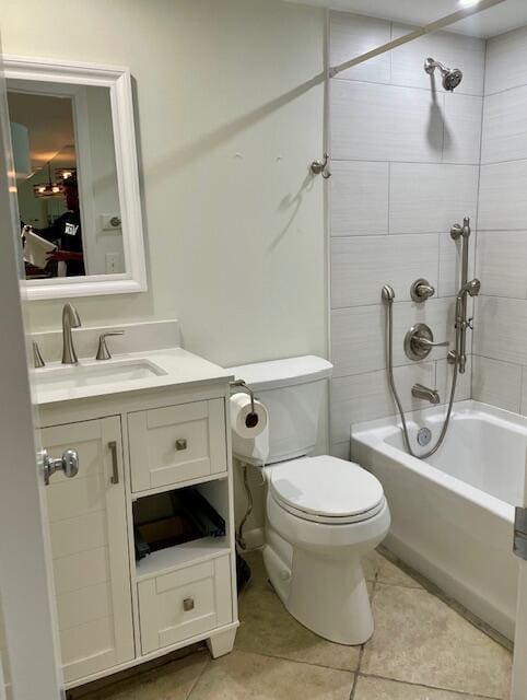 full bathroom featuring tile patterned floors, vanity, toilet, and tiled shower / bath