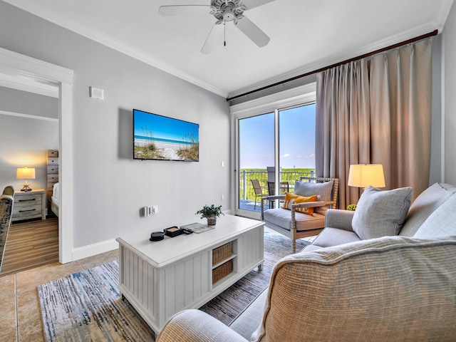 tiled living room featuring ceiling fan and ornamental molding