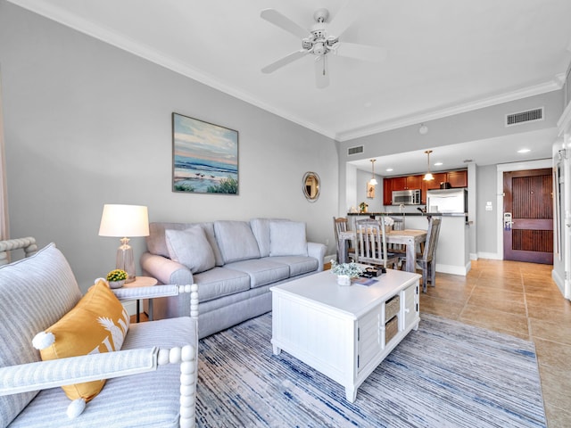 tiled living room featuring ceiling fan and ornamental molding