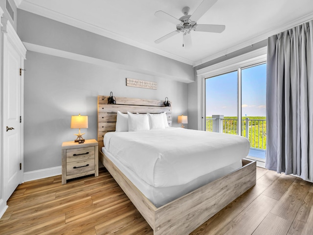 bedroom featuring ceiling fan, hardwood / wood-style flooring, ornamental molding, and access to outside